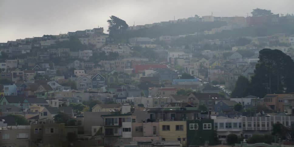 Apartment buildings and homes on a hill in san francisco on a hazy day