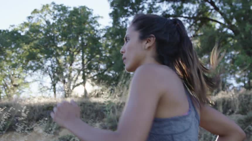 A woman jogging in a rural area