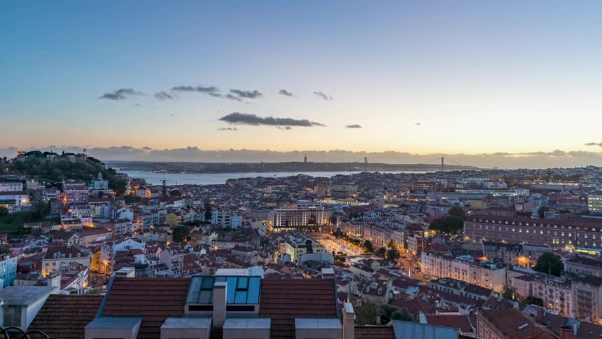 Coastal small city from above during morning afternoon and night