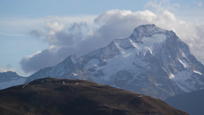 The mountains are covered with fog
