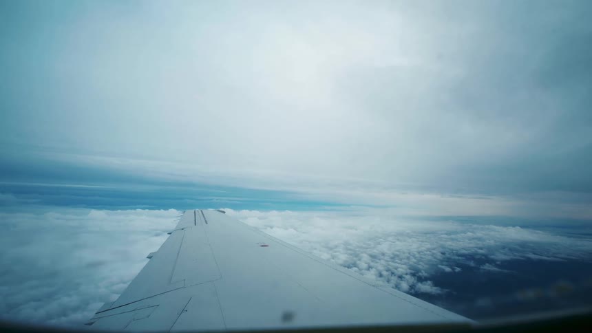 A plane is flying high in the sky
