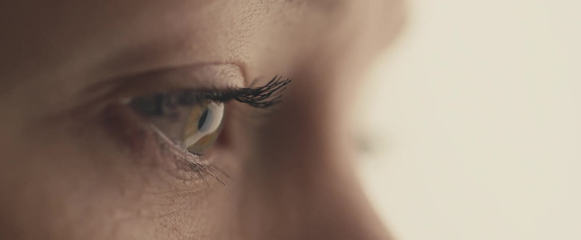 Close up of womans eyes looking into space