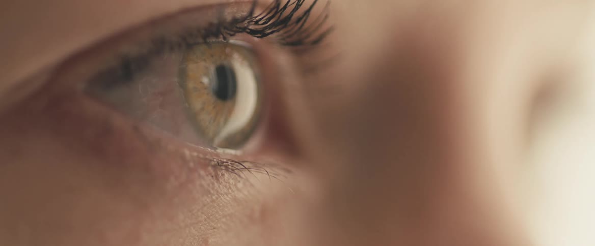 Close up of eye looking into space
