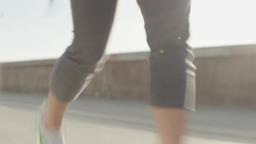 A person is walking over a concrete road