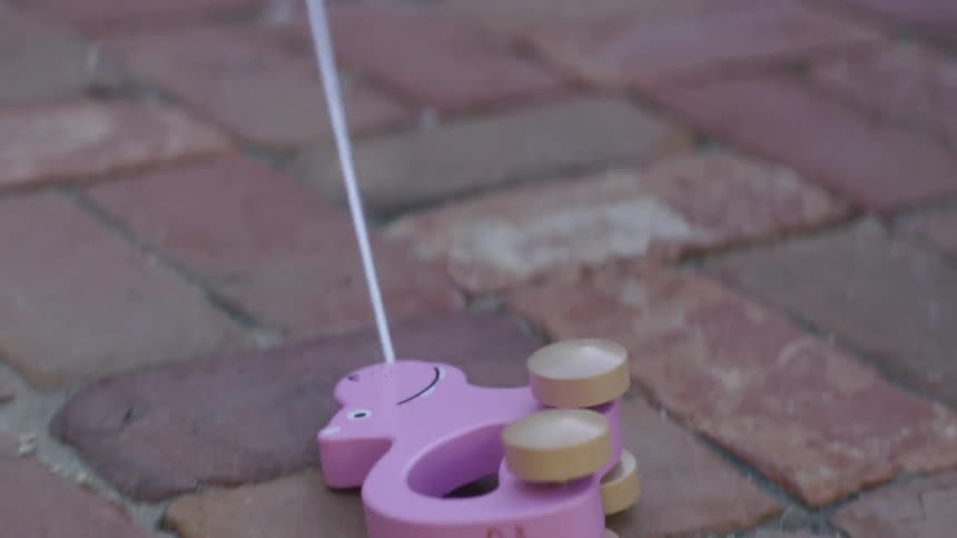 Toy being drug by its string