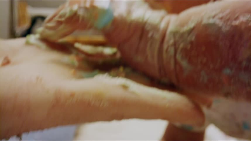 A mother and baby with paint