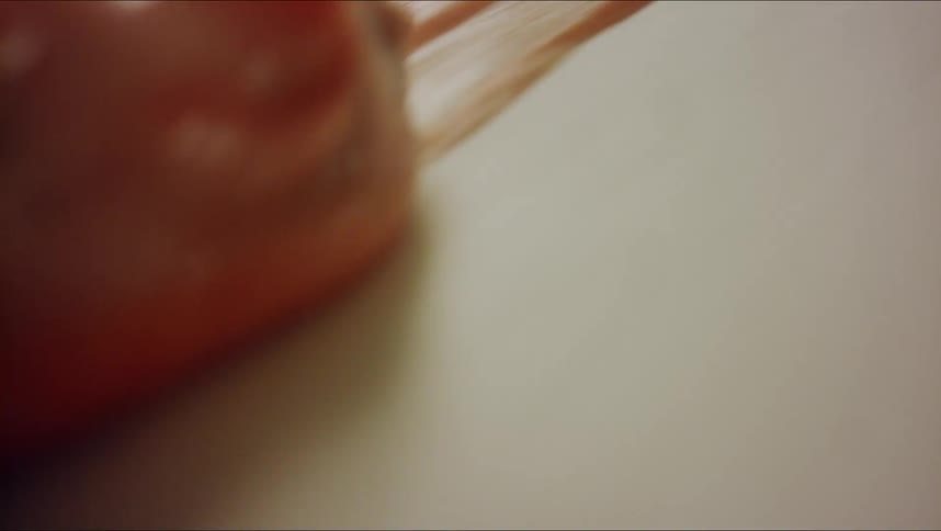 Paint is smeared with a finger
