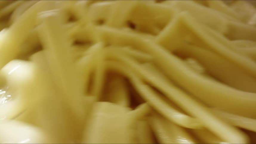 A view of pasta being stirred