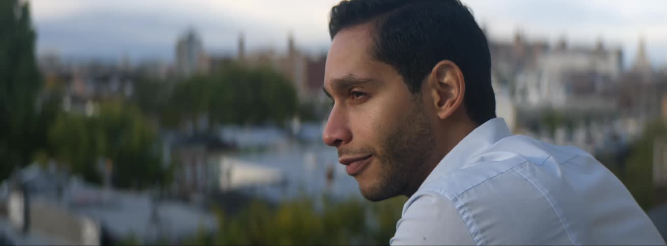 A man is sitting outdoors in the spring