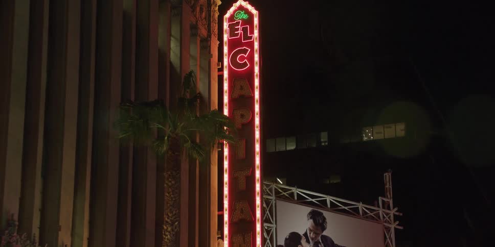 A view of signs on a building outdoors at night