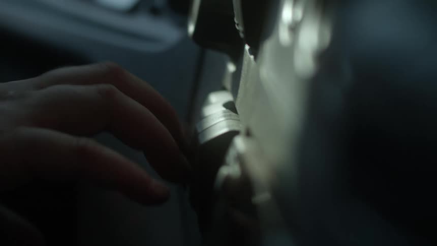 Person manipulates lock on car door