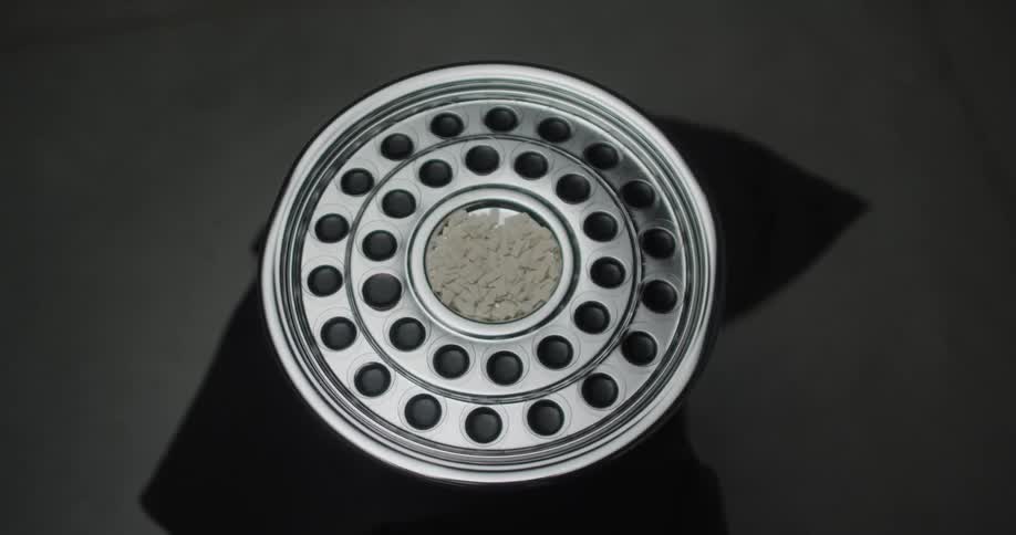 A view of a wheel with holes in it