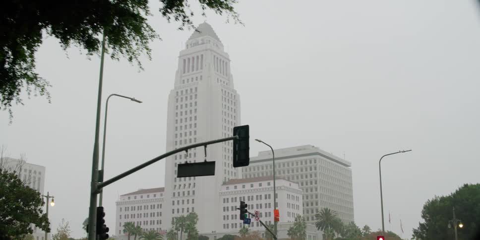 The fog is covering the tall white building
