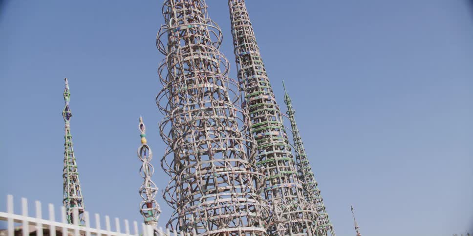 A los angeles city street leading to the watts towers at simon rodia state historic park