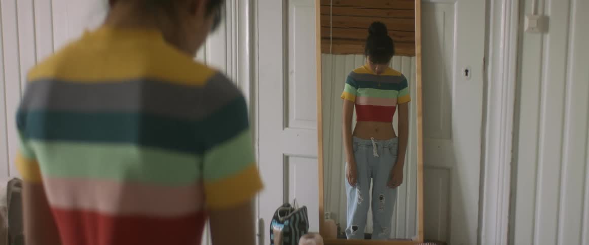 A woman looking in a mirror