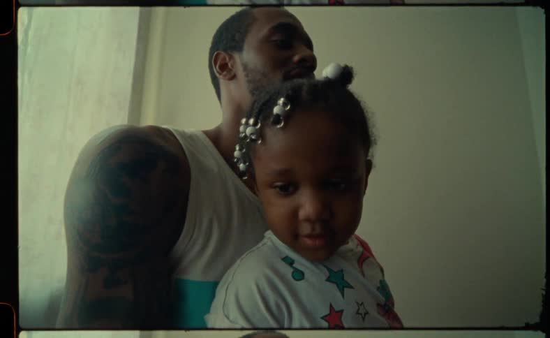 A child sits on her fathers lap