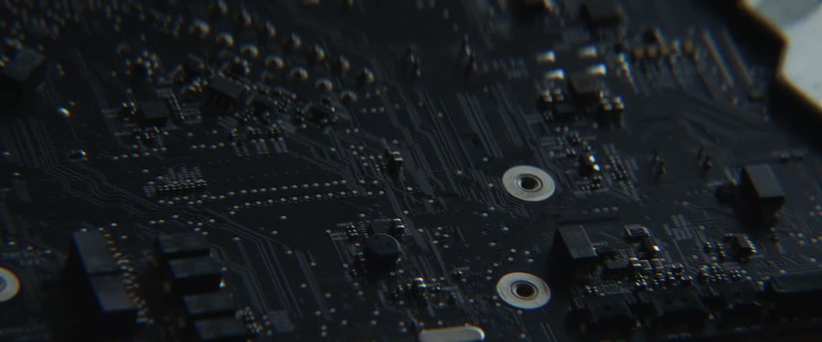 A person is holding a motherboard for a computer