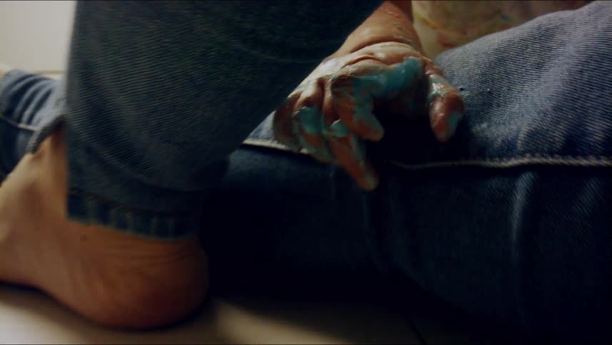 A person is touching someones leg