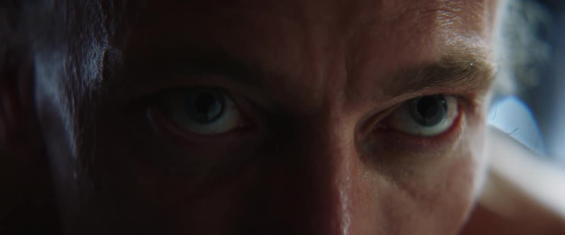 Close up view of a mans face is displayed