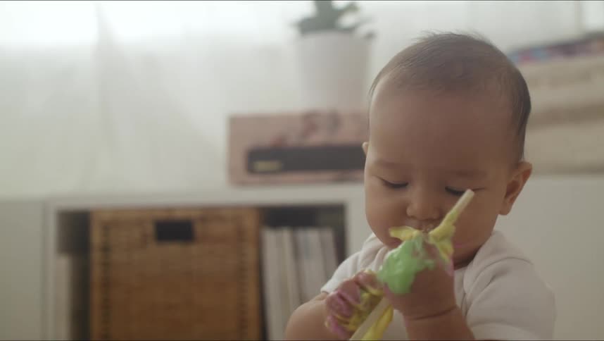 A baby is eating at home