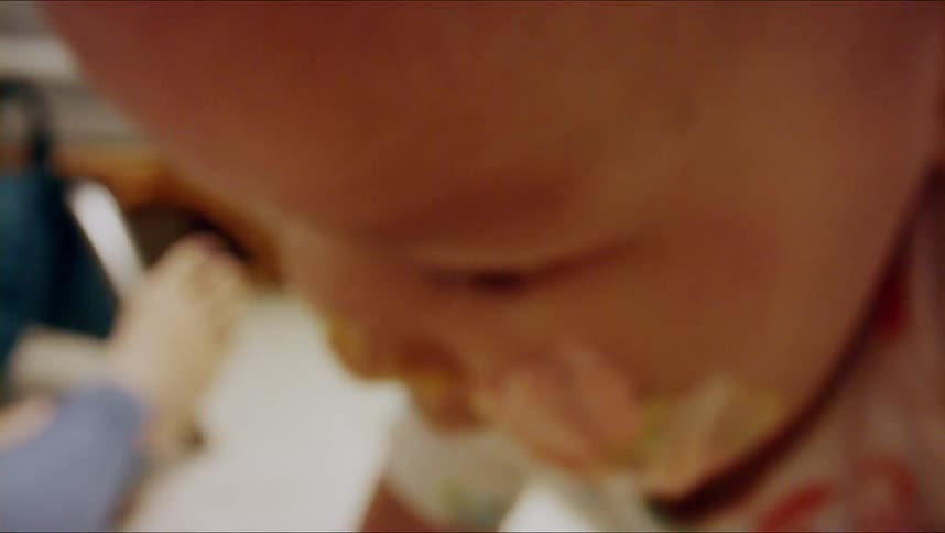 Infant with icing on its face