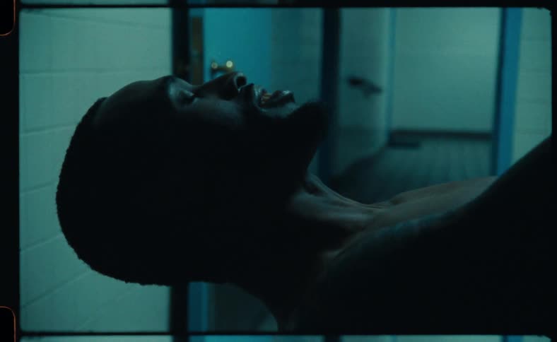 A man is laying down in a room