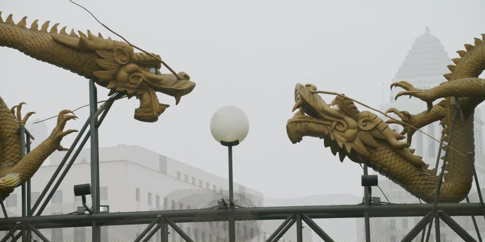 Art sculptures are shown in a downtown city