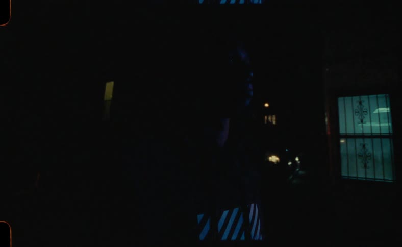 A portrait of a man standing in a room