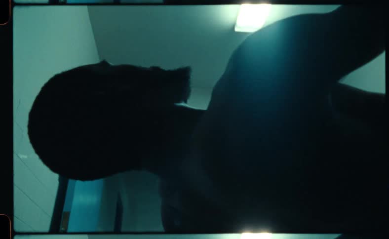 Close up of a mans face and chest area