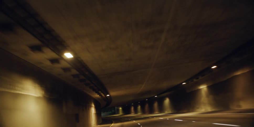 Traveling on a highway at night and through a tunnel