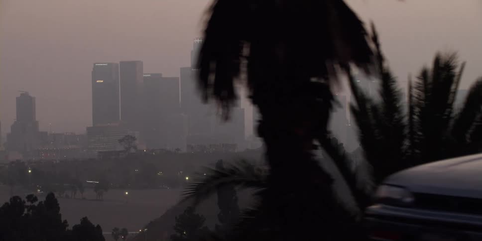 City skyline with high rise buildings in fog at dawn
