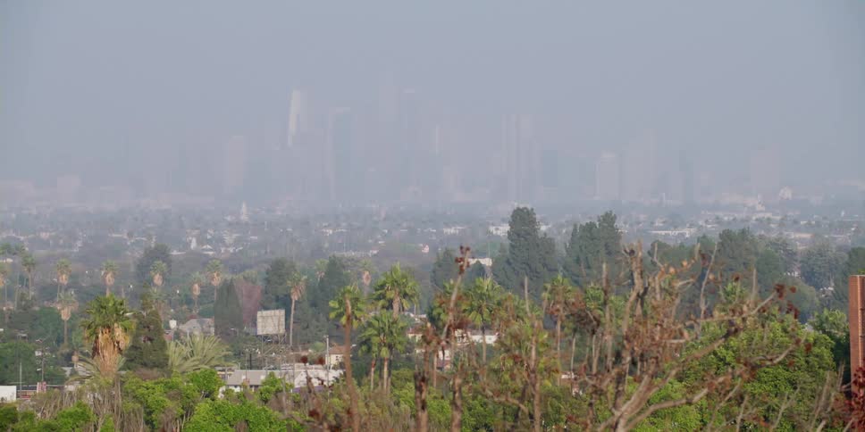 Thick smog obscures the downtown skyline
