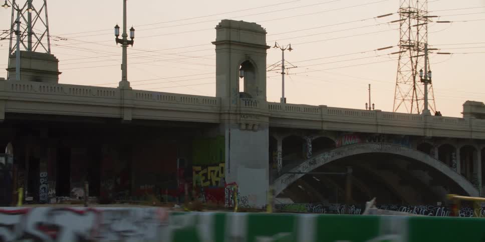 Vehicles travel over the bridge in the city