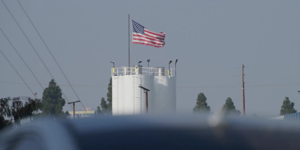 An american flag flies on top of a biorefinery building