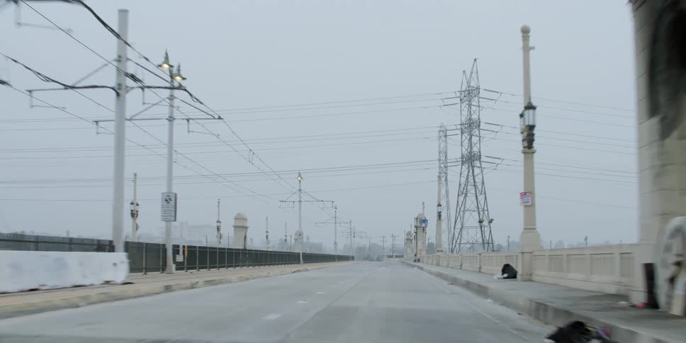 Traveling on a road lined with utility cables and utility towers