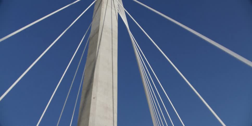 A view of a suspension bridge is displayed