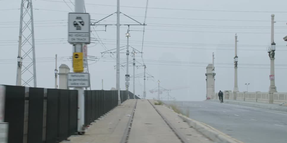 A single person rides their bicycle on the road