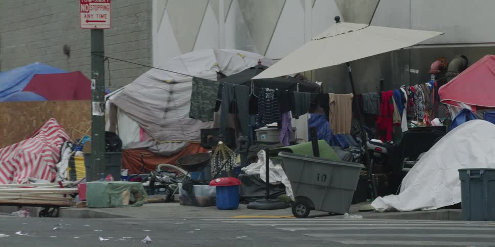 A view of some tents next to a building outdoors