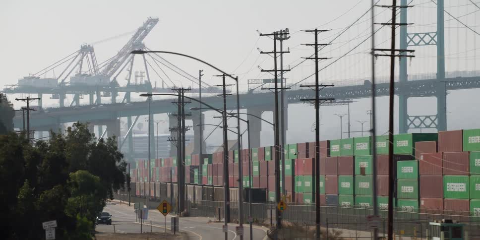 The port is covered with shipping containers