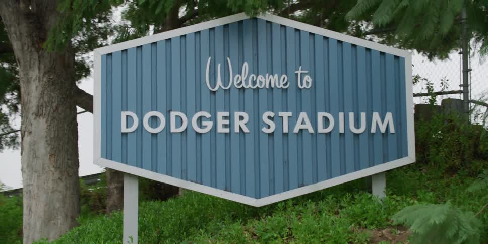 A sign outside welcoming people to dodger stadium