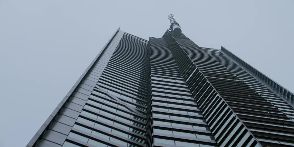 High rise office building against the cloudy sky in the city