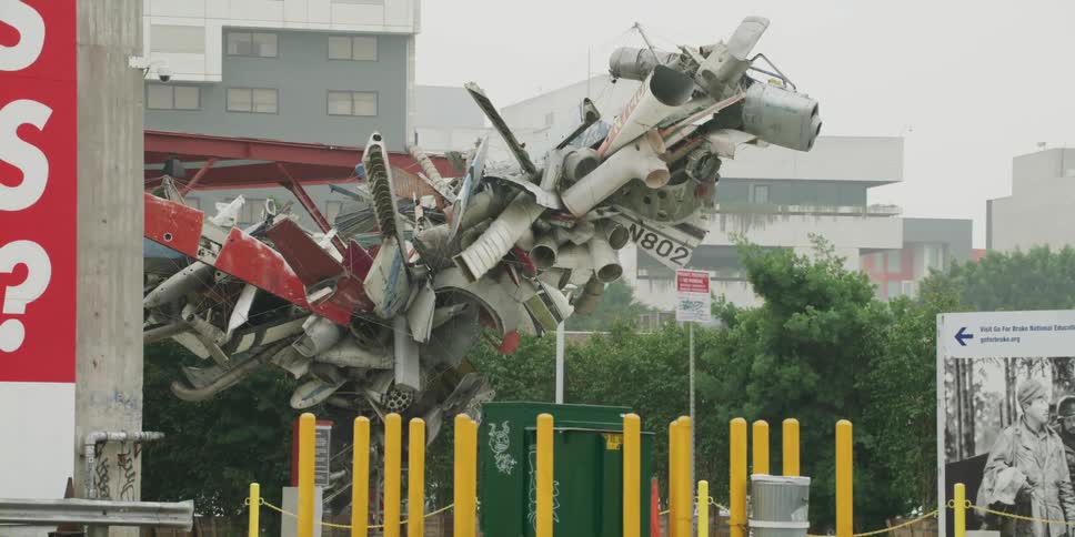 A sculpture on a city sidewalk
