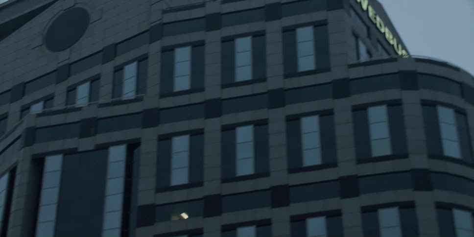 Exterior view of high rise office buildings on cloudy and foggy day