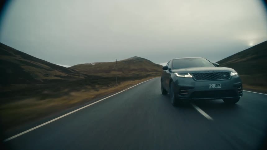 A vehicle switches lanes back and forth while driving down a curved road