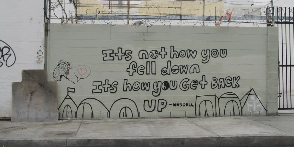 Graffiti is covering city walls in the daytime