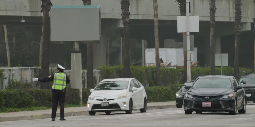A person directing traffic outdoors
