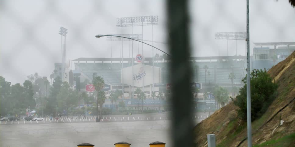 Cars parked outside a stadium