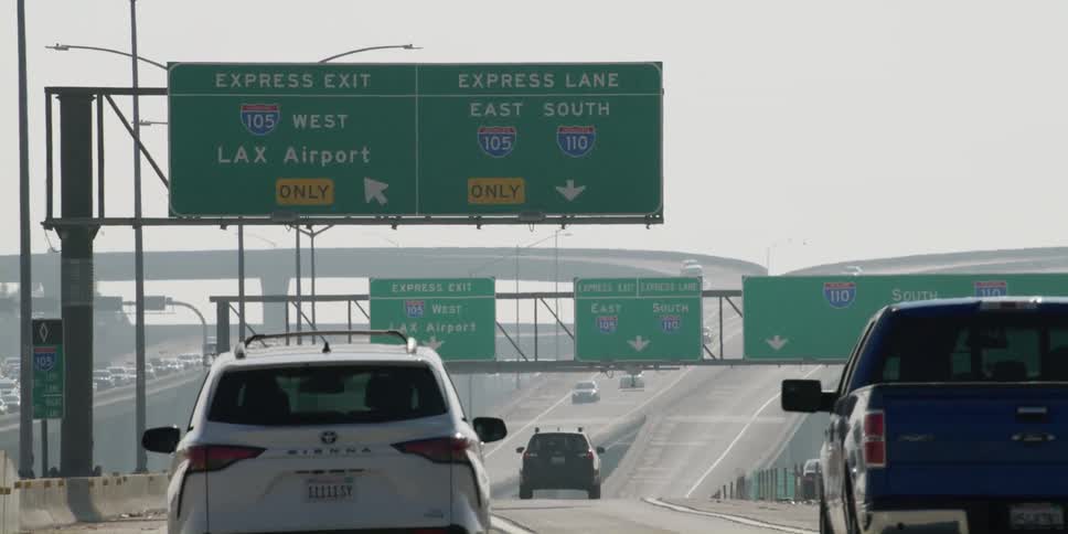 Traffic on a highway as a car travels in the lane going to lax airport