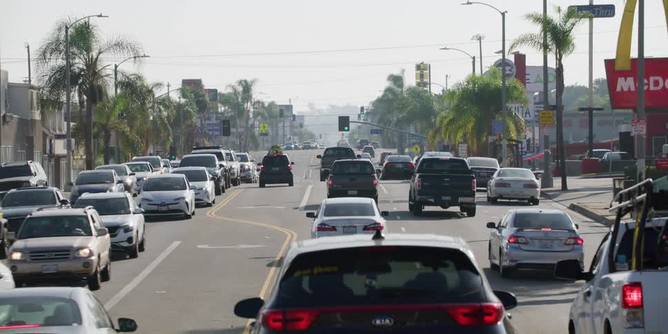 Cars drive on city highway