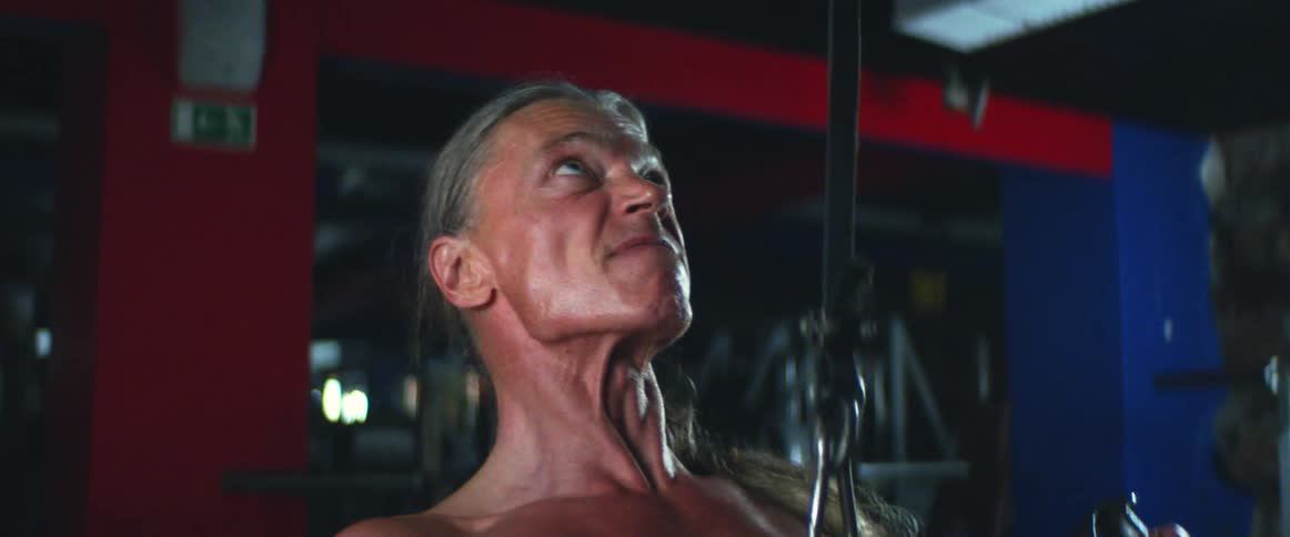 A man is working out in a gym